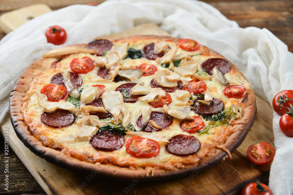 Pizza With Tomato Sauce, Pepperoni Sausage, And Mushrooms On Wooden Background Natural Rustic, A Pizza Cutter And Ingridienty.