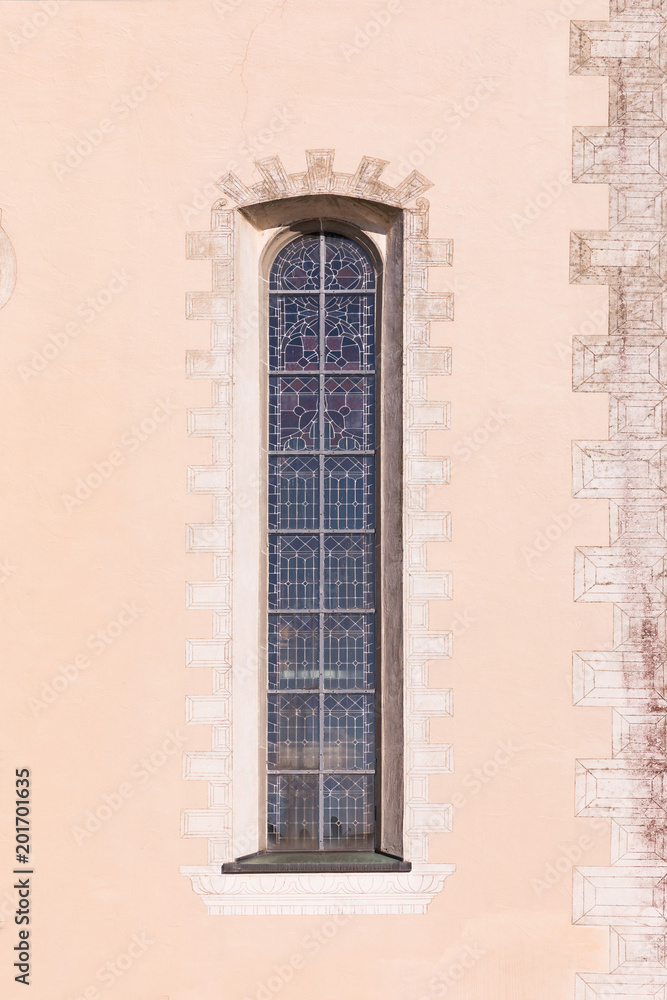 Narrow Gothic window of the church.