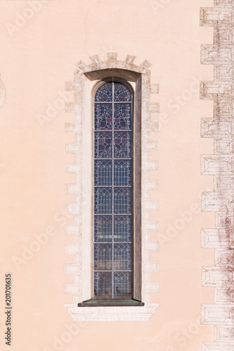 Narrow Gothic window of the church. © murmakova