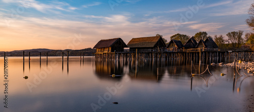 Colorfull sunset at Lake Dwellings of the Stone and Bronze Age in Unteruhldingen on Lake Constance, Baden-Wurttemberg photo