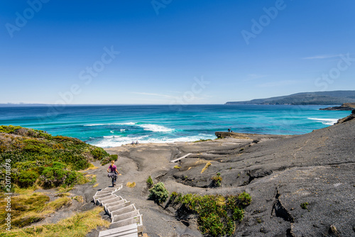 Amazing view to stunning rocky sandy beach deep blue water of southern ocean antarctica on warm sunny day with blue sky after hiking on to South Cape Bay, South-West National Park, Tasmania, Australia © Thomas Jastram