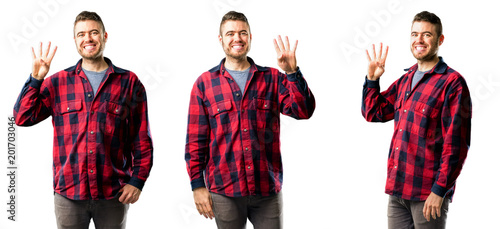Young man raising his finger, is the number four isolated over white background, collage composition