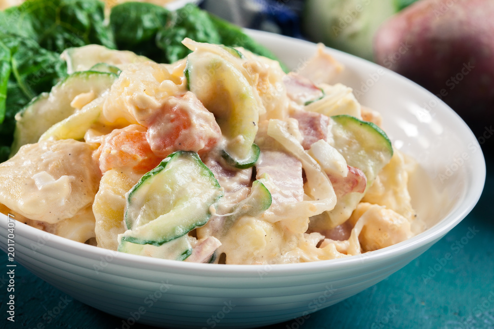 Delicious potato salad with ham, egg and cucumber Delicious potato salad with ham, egg and cucumber