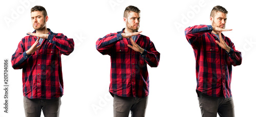 Young man serious making a time out gesture with hands isolated over white background, collage composition