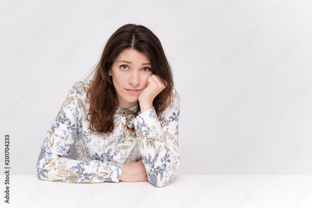 beautiful girl sitting at a table in different poses beautiful girl sitting at a table in different poses