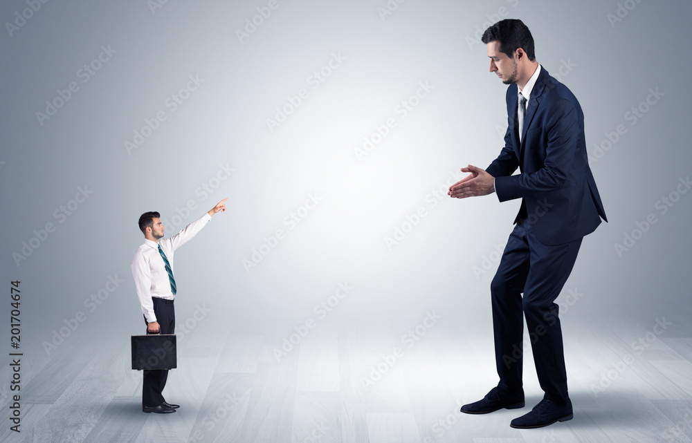 Small businessman in shirt pointing to an afraid businessman
Small businessman in shirt pointing to an afraid businessman
