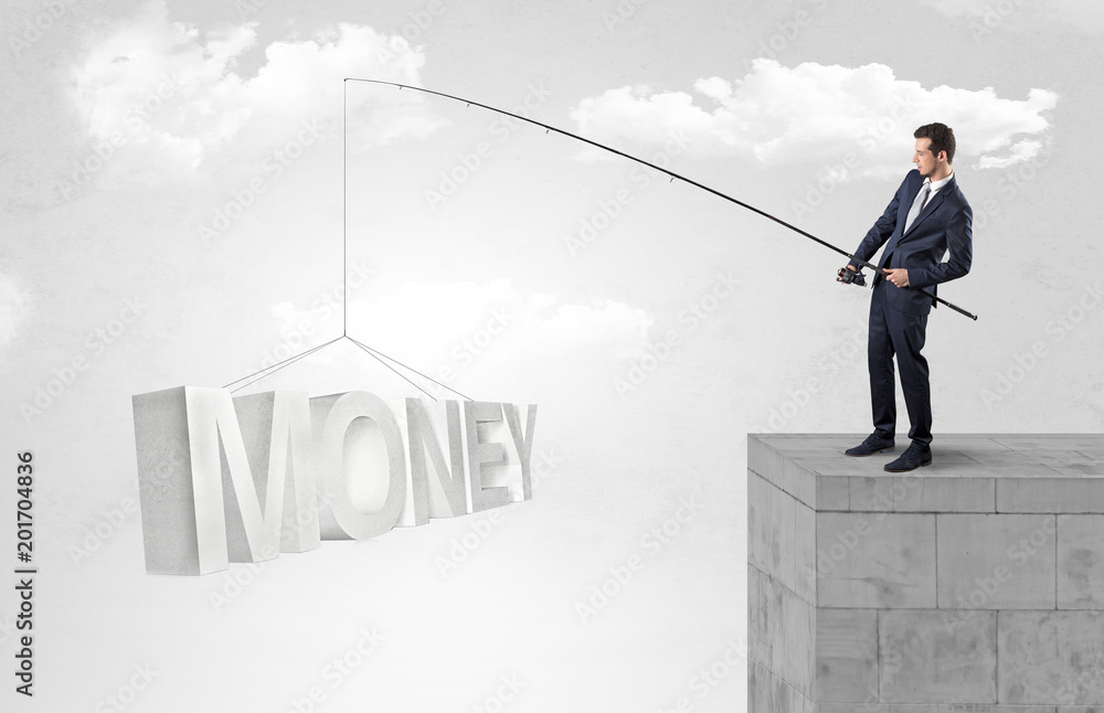 Young businessman fishing money, income from the top of a building
Young businessman fishing money, income from the top of a building