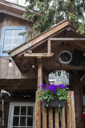 Traditional wooden treehouse in the yard for children 