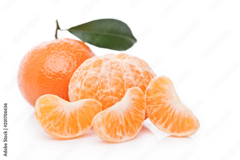 Fresh organic peeled mandarin fruit with leaves Fresh organic peeled mandarin fruit with leaves