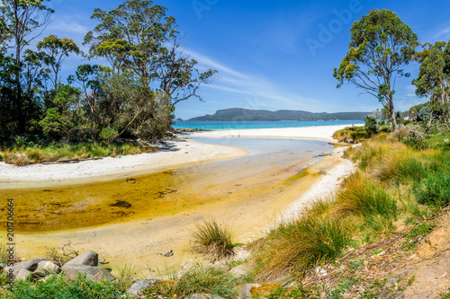 Amazing view to great paradise island sandy beach with turquoise blue water and green shore jungle forest on warm sunny clear sky relaxing day, River Adventure Bay, Bruny Island, Tasmania, Australia