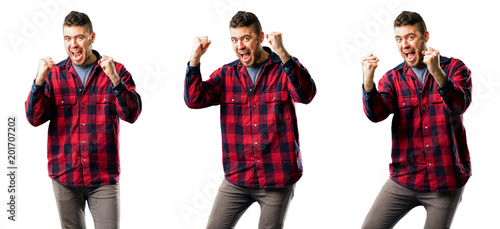 Young man happy and excited celebrating victory expressing big success, power, energy and positive emotions. Celebrates new job joyful isolated over white background, collage composition