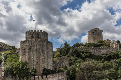 One of the towers of Rumeli Fortress overlooks the Bosphorus Strait in Istanbul, Turkey. photo