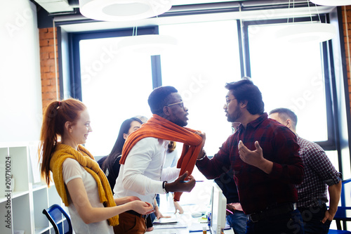 conflict among diverse co-workers in the modern office. pick on black office worker