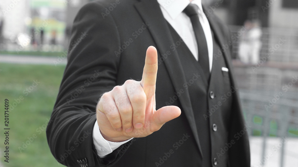 close up.businessman showing index finger up