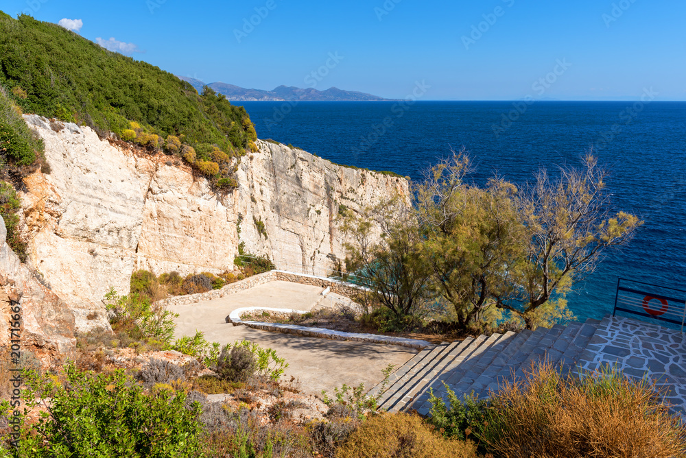 Viewpoint terrace stairs in sunny day. Blue sea near Skinari Cape on Zakynthos island. Greece