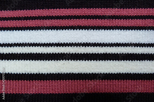 knitted knitted fabric close-up wool scarf background for decor black white pink stripes