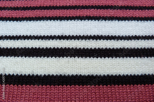 knitted knitted fabric close-up wool scarf background for decor black white pink stripes