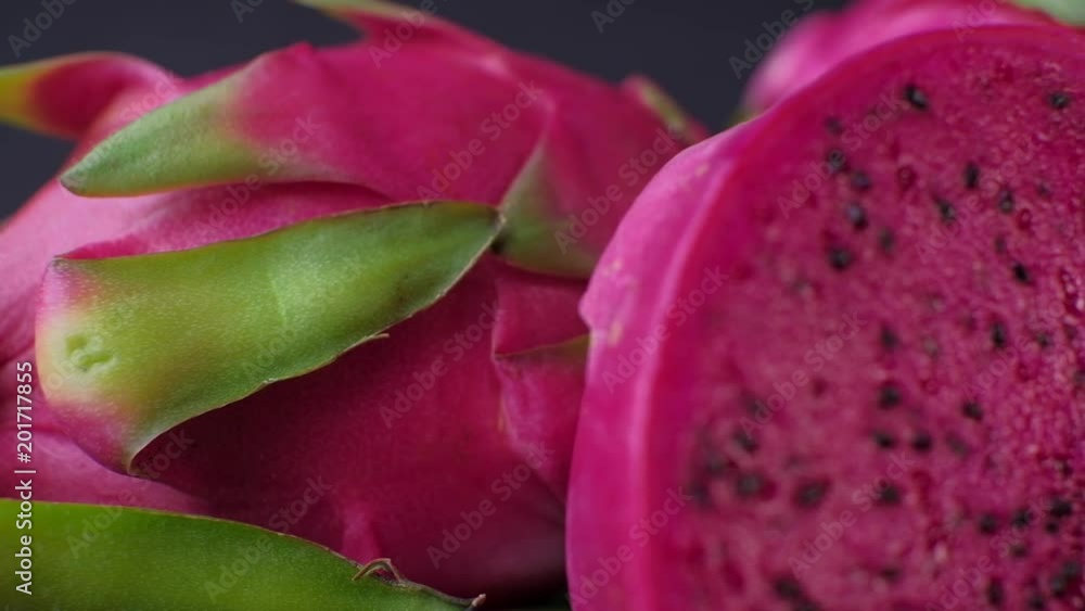 Dragon fruit on dark background. Trucking shot. 4K resolution. Dragon fruit on dark background. Trucking shot. 4K resolution.