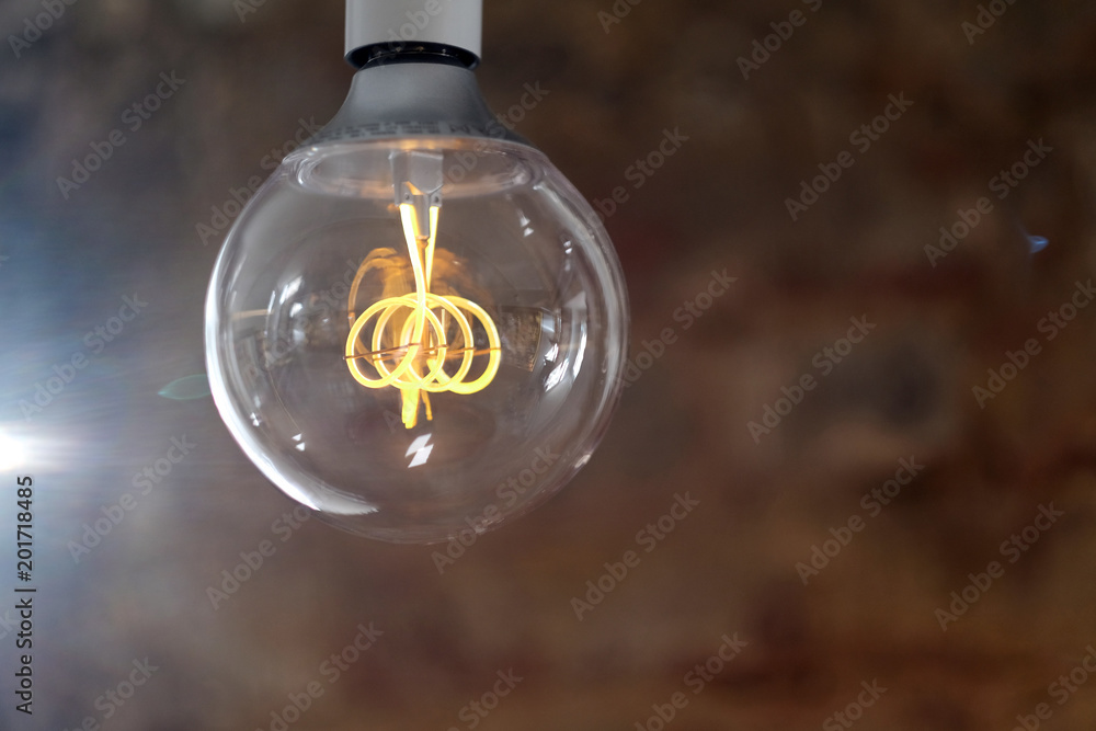 Modern LED lamp with a ball-shaped glass bulb design in retro style Modern LED lamp with a ball-shaped glass bulb design in retro style