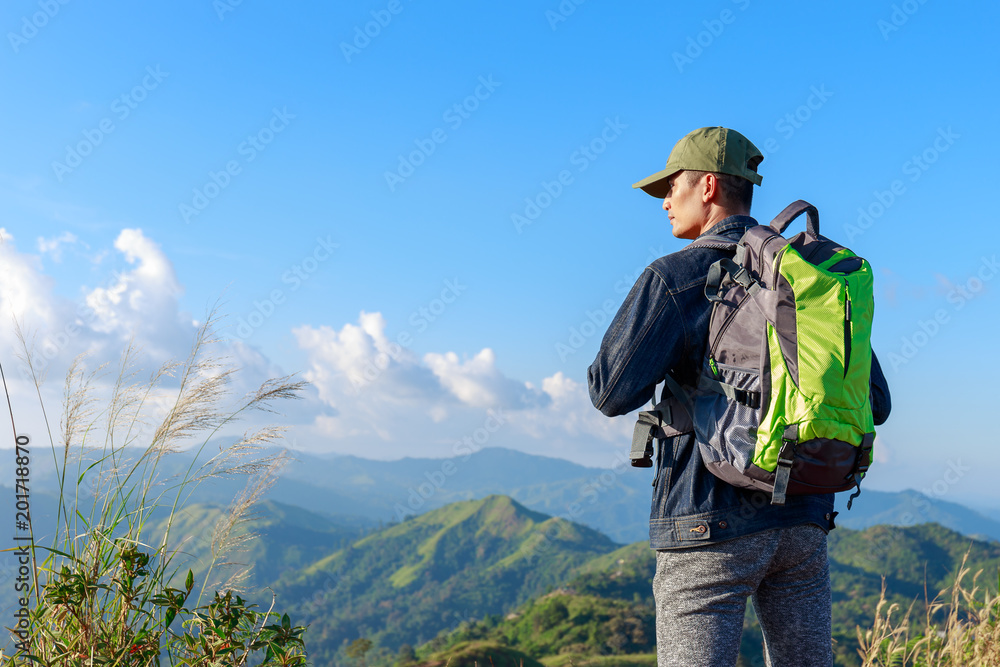 .Traveler man with backpack mountain for vacation outdoor and background.