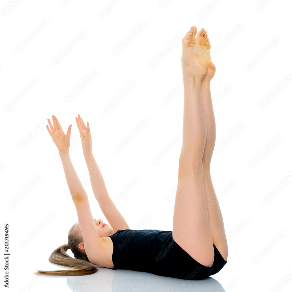 The gymnast perform an acrobatic element on the floor. The gymnast perform an acrobatic element on the floor.