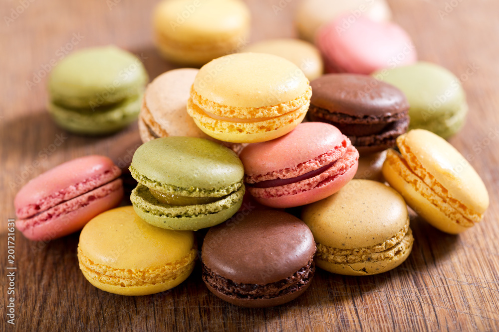 colorful macaroons on wooden table colorful macaroons on wooden table