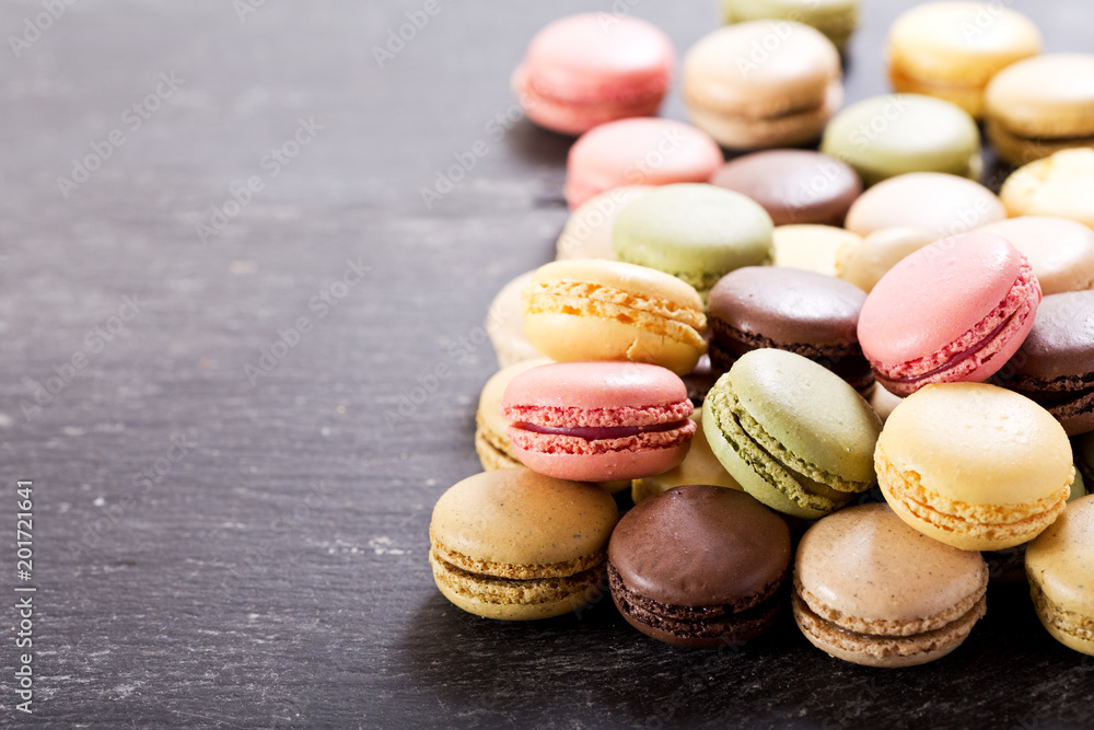 colorful macaroons on dark table colorful macaroons on dark table