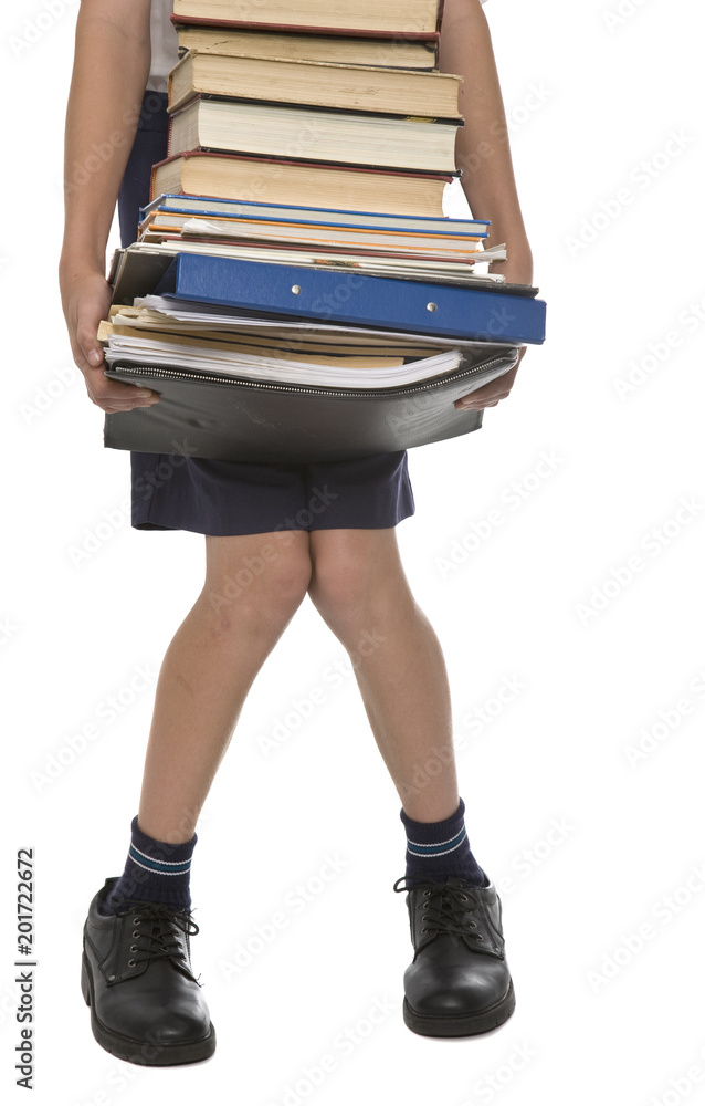 A pair of legs buckling under a huge pile of books. Stock Photo | Adobe  Stock