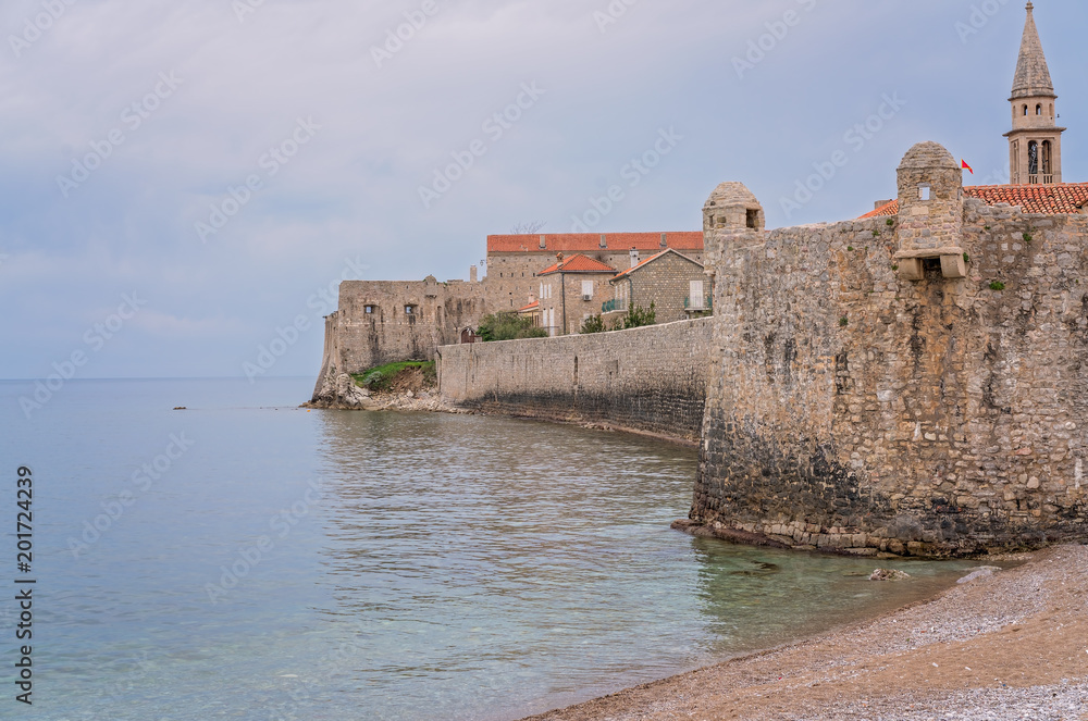 Thick walls of the old town fort in Budva