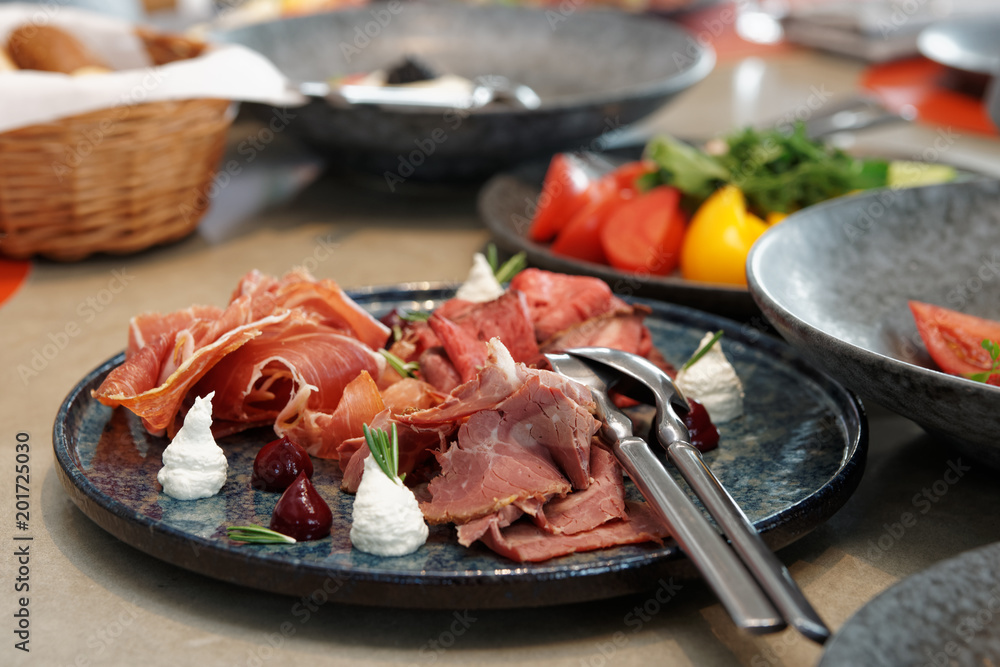 Assortment of cured and smoked meats and roast beef Assortment of cured and smoked meats and roast beef