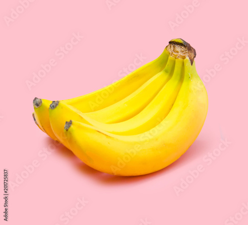 Bunch of bananas on a pink background