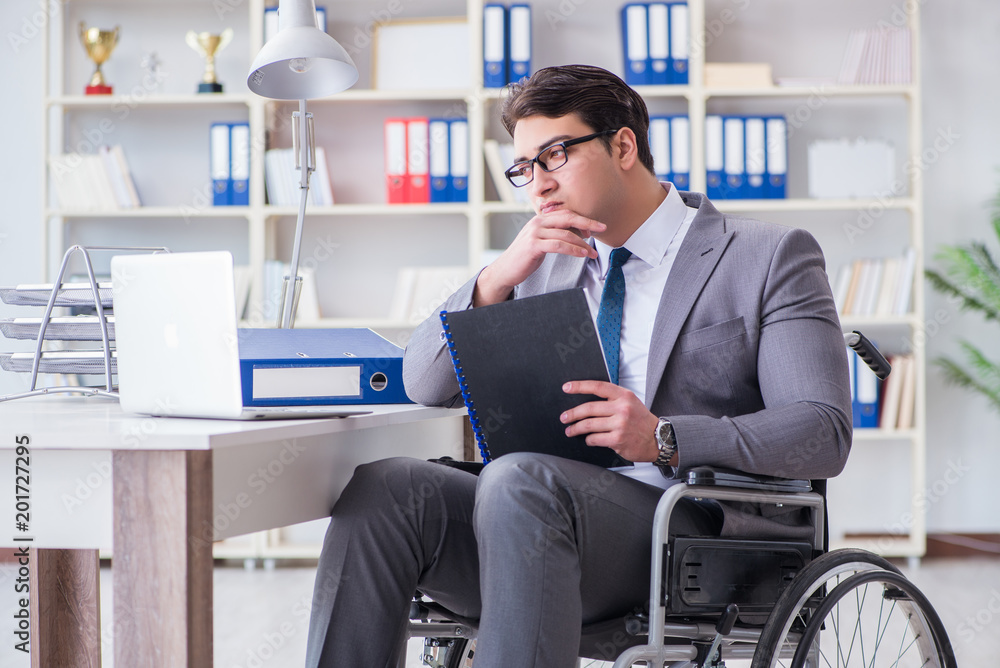 Disabled businessman working in the office Disabled businessman working in the office