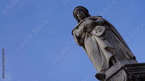 marble statue of the poet Walther von der Vogelweide in a public place photo