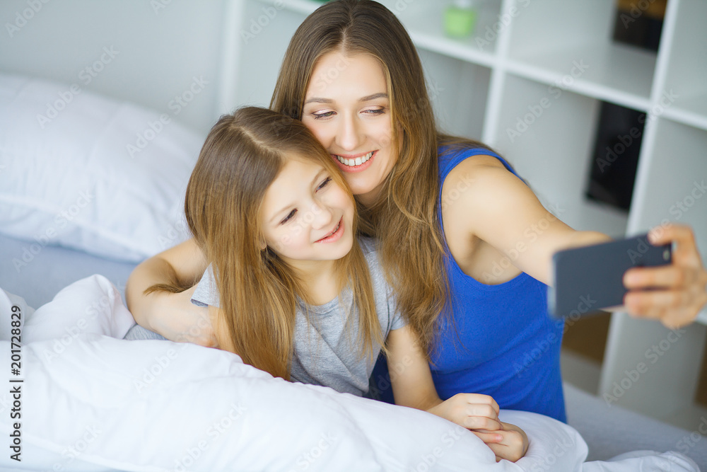 Young family taking selfie in bed Young family taking selfie in bed