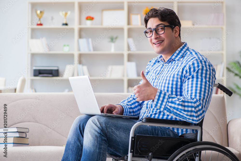 Young student on wheelchair in disability concept Young student on wheelchair in disability concept