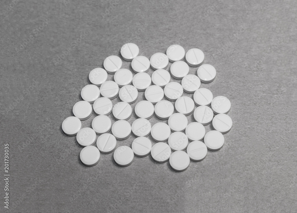 pile of tablets on cardboard paper. pile of tablets on cardboard paper.