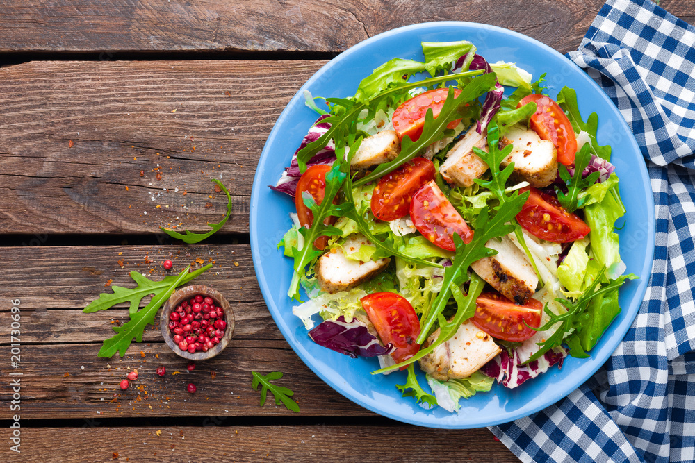 Vegetable salad with chicken meat. Salad with fresh vegetables and grilled chicken fillet Vegetable salad with chicken meat. Salad with fresh vegetables and grilled chicken fillet