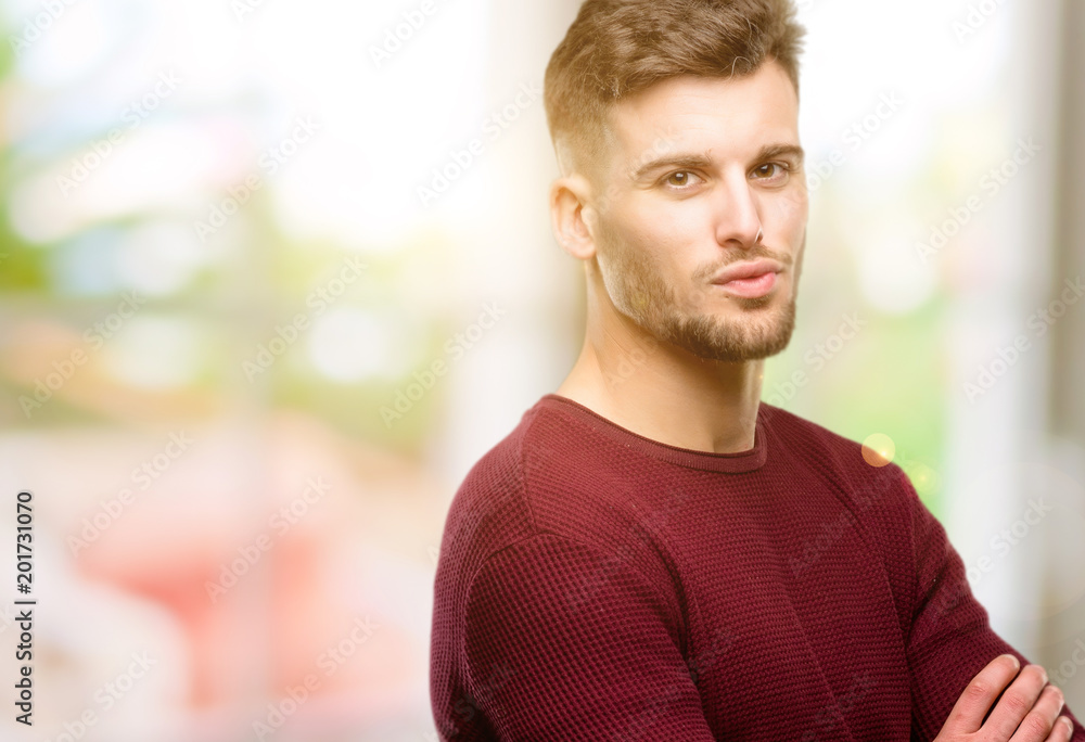 Handsome young man expressing love, blows kiss at camera, flirting Handsome young man expressing love, blows kiss at camera, flirting