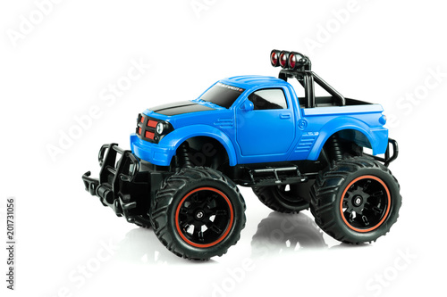 Blue RC SUV Off road truck car (Radio-controlled) isolated on white background. (This toy has some dust from children playing)