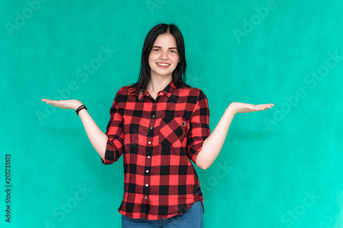 beautiful young brunette girl on a green background in different poses