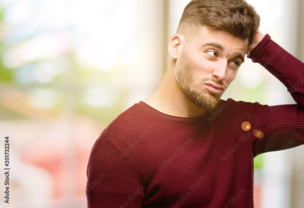 Handsome young man doubt expression, confuse and wonder concept, uncertain future Handsome young man doubt expression, confuse and wonder concept, uncertain future