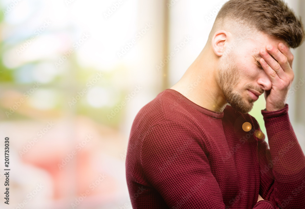 Handsome young man stressful keeping hands on head, tired and frustrated Handsome young man stressful keeping hands on head, tired and frustrated