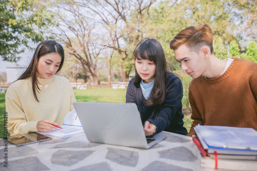Group Students Smile and have fun It also helps to share ideas in the work and project. And also review the book before the exam in the garden.