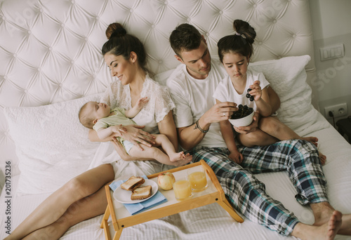 Young familly on the bed