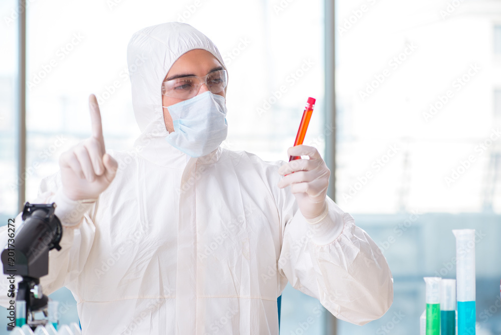 Man doctor checking blood samples in lab Man doctor checking blood samples in lab