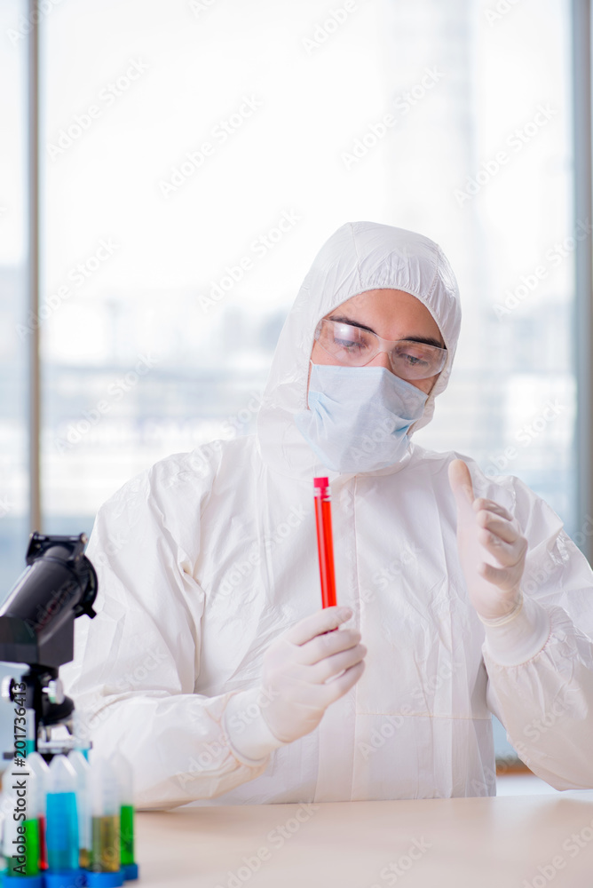 Man doctor checking blood samples in lab Man doctor checking blood samples in lab