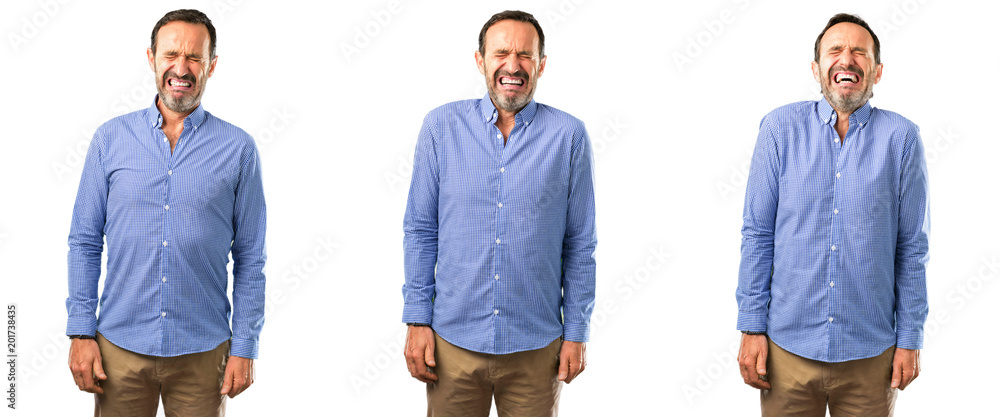 © Krakenimages.com - Middle age handsome man crying depressed full of sadness expressing sad emotion over white background