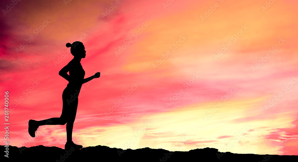 Silhouette of woman running  on Mountain road during sunrise.Health concept