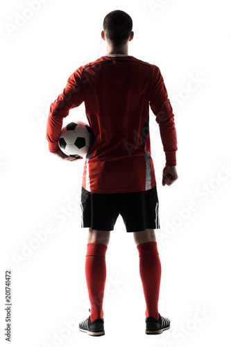 Rear view of silhouette of young football player isolated on white background © F8  \ Suport Ukraine