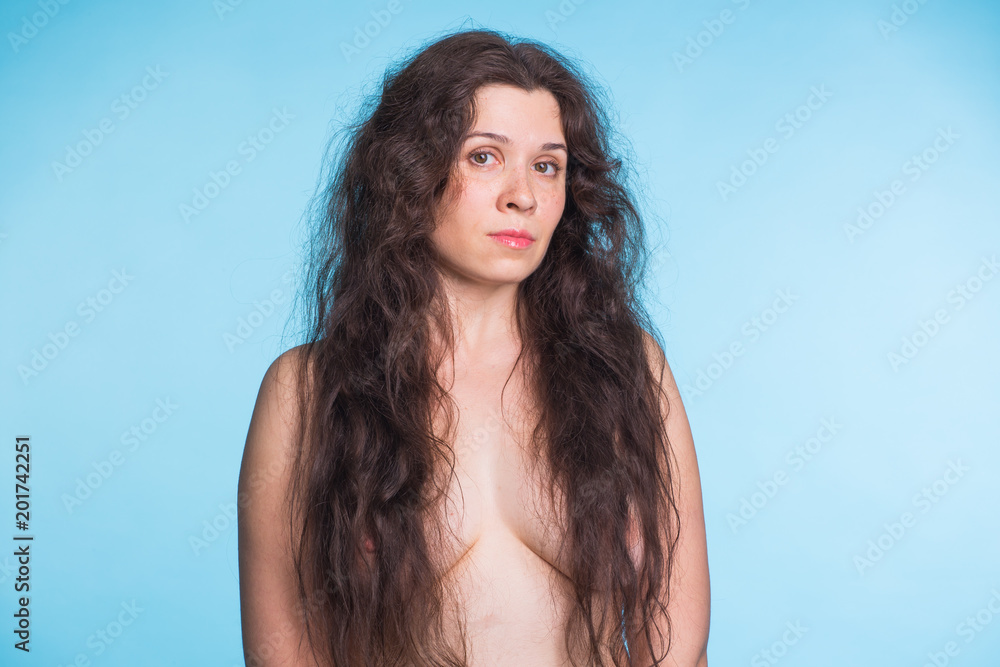 Portrait of beautiful nude woman on blue background Portrait of beautiful nude woman on blue background